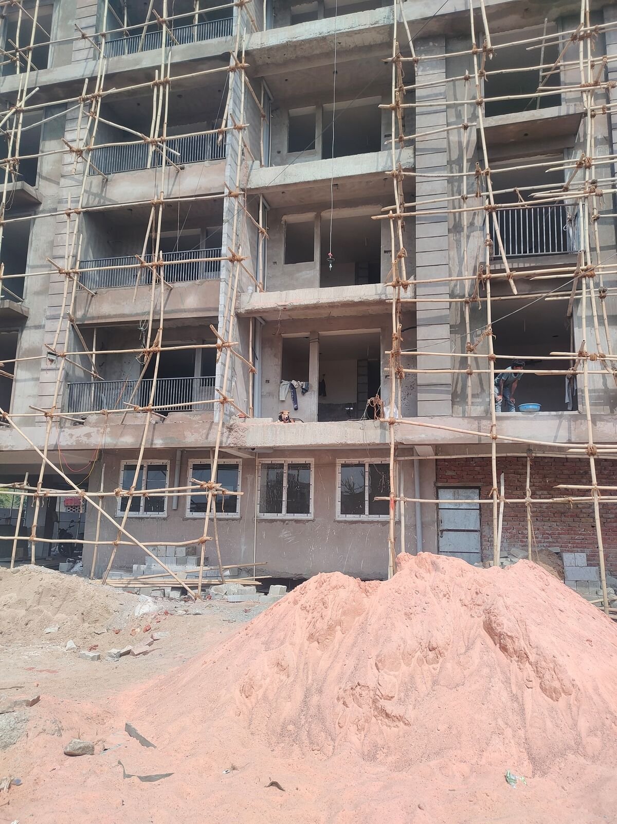 Construction progress at Mangal Deep - completed RCC frame and balconies