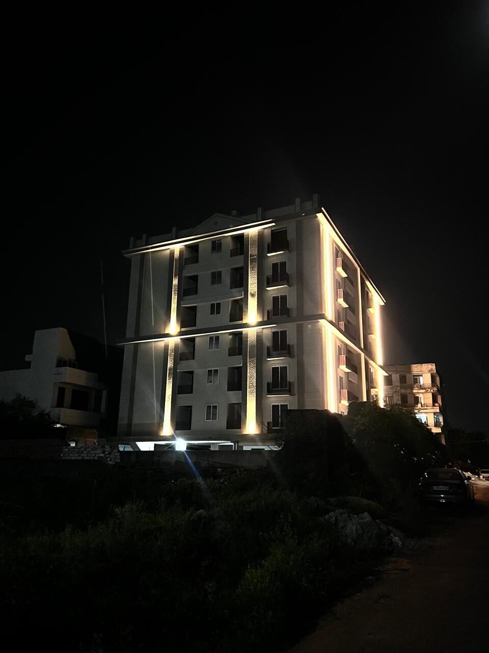 Night view of Mangal Deep Apartments from the approach road